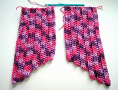 two pink and purple crocheted pieces of cloth