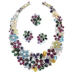 This beautifully hand crafted Multi-colored necklace, earrings, and ring suite from the renowned jeweler Gregg Ruth is from his ‘Malibu Beach Collection’. Made up of a fabulous array of colored stones, such as blue topaz, Amethyst, green and pink Tourmaline, Rubilite and Diamonds. This necklace with matching earrings and ring is an absolute show stopper! The necklace has 165 colored stones weighing 422.13ct , 2048 diamonds weighing 27.77ct. The earrings have 51.37ct in colored stones, and 2.64ct Funny Jewelry, Solitaire Diamond Pendant, Malibu Beach, Pearl And Diamond Necklace, Jewelry Brands, Beach Collection, Expensive Jewelry, Ancient Jewelry, Ruby Earrings