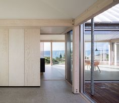 an open room with sliding glass doors leading to the outside