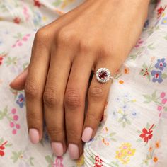 The Story A timeless cluster ring with a striking stone at center. Sitting at the center of this piece is a richly colored spinel weighing approximately 1.17 carats. The vintage cut stone is saturated in a red hue. Prong set, it's surrounded by a halo of 13 chunky Old Mine cut diamonds, weighing 0.04 to 0.05 carats each, giving the ring a total diamond weight of approximately 0.59 carats. The setting, from circa 1905, was beautifully paired with the vintage cut spinel which was added at a later date. The center spinel makes it pop with color. It looks amazing on the hand with its universally flattering shape and size. We love it on its own or paired with other favorite pieces. It would make a fantastic engagement ring for someone looking for a unique and colorful piece. The Specs Style Num Timeless Emerald-cut Ruby Ring, Fine Jewelry Birthstone Ring For Proposal, Luxury Ruby Cluster Ring With Center Stone, Exquisite Ruby Ring, Luxury Cluster Ruby Ring With Center Stone, Fine Jewelry Halo Ring With Center Stone For Proposal, Fine Jewelry Diamond Cluster Gemstones, Classic Cluster Ruby Ring With Center Stone, Classic Ruby Cluster Ring With Center Stone