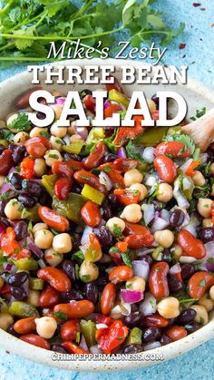 a white bowl filled with beans and vegetables