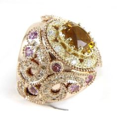 This Is A Huge Wide Oval Citrine Ring W/Diamond & Kunzite Accents. It Is Made Of 100% Natural 14kt Rose Gold And Is In Brand New Condition. It Has A Ctw Of 6.50ct (1.34 Diamond/5.16 Citrine + Kunzite) And Weighs 23.5 Grams. The Fancy Diamonds Have A Clarity Of Si1 And F Color. This Custom Piece Has An Excellent Oval Cut Citrine Stone, Surrounded By A Diamond And Pink Sapphire Accents That Have A Filigree Design Around The Band Of This Huge Ring. Huge Rings, Orange Ring, Fancy Diamonds, Citrine Ring, Citrine Stone, Filigree Design, Pink Sapphire, Womens Jewelry Rings, Oval Cut