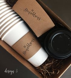 two coffee cups in a cardboard box with lids