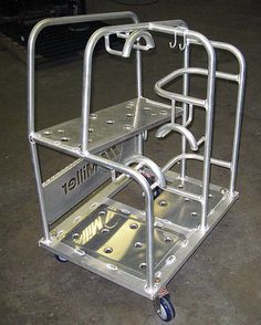 a small metal cart with wheels on the floor