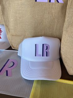 Brides, bachelorette, birthdays and more! This personalized hat is the perfect memorable gift that can be worn year round! Details: Seamless foam front Slightly curved visor Custom wording is permanent but not embroidered (no thread) Enter monogram in personalization box One size fits most - plastic snap closure Initial Trucker Hat, Bride Trucker Hat, Bachelorette Trucker Hats, Shadow Monogram, Personalized Hat, Pink Trucker Hat, Spirit Store, Black Trucker Hat, Straw Hat Beach