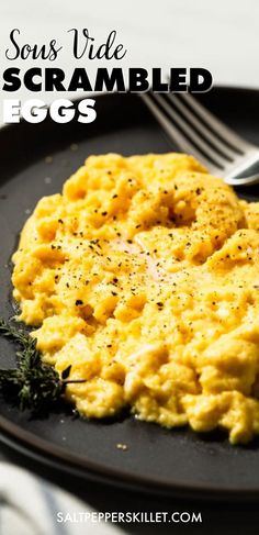 scrambled eggs on a black plate with a knife and fork next to it, text reads son's side scrambled eggs