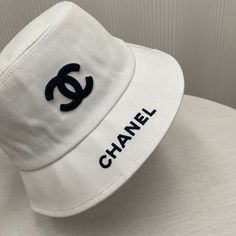 Size: Standard Size It comes with Dust box, Care manual, Tag, and Paper bag. Chanel Hat, Hat Aesthetic, Chanel Accessories, New Handbags, Crossbody Shoulder Bag, Fashion Statement, Wellness Design, Caps Hats, Bucket Hat