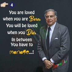 a man in a suit and tie standing next to a chalkboard with the words, you are loved when you are born