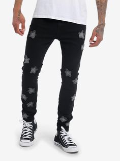 Let these little stars light up your look! These black stinger jeans are decorated with grey star patches with frayed edges.62.5% cotton; 32.5% polyester; 2% spandex; 3% other fibersWash cold; dry lowRise: 10"Inseam: 30"Leg opening: 5 14"ImportedListed in men'sunisex sizesModel is 6'1"Model wears size 32 Trendy Black Bottoms With Star Print, Trendy Black Jeans With Star Print, Black Star Print Bottoms For Streetwear, Star Embroidered Jeans Men, Hot Topic Pants, Black Star Pocket Jeans, Black Gothic Jeans, Black Jeans Boys, Stars Light