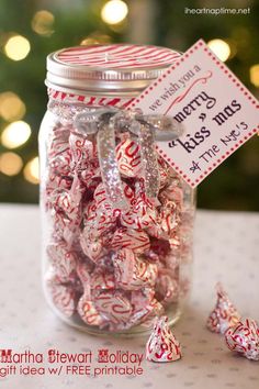 a jar filled with red and white candy