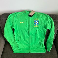 Nike Authentic Brazil National Team World Cup 2022 Jacket Dh4741-330 Men’s Sz: M 100% Authentic Men’s Size: Medium New With Tags! Green Nike Windbreaker For Sports, Green Long Sleeve Track Jacket For Sports, Nike Green Sportswear Windbreaker, Nike Green Long Sleeve Windbreaker, Nike Green Hooded Track Jacket, Green Sporty Sport Coat, Green Nike Track Jacket For Streetwear, Green Hooded Outerwear For Sports Events, Nike Green Casual Track Jacket