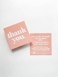 two pink thank cards with the words thank you written in white ink on top of them