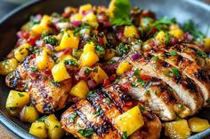 grilled chicken with pineapple salsa in a bowl