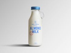 a bottle of almond milk on a white background