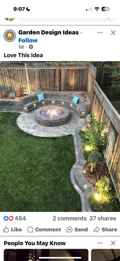 an outdoor fire pit surrounded by green grass