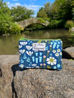 Elevate your style and stay organized with our charming blue flowers small coin purse. Handcrafted with 100% corduroy fabric, this compact accessory is a game-changer for your on-the-go needs. Tired of digging for loose change? Our small coin purse is here to save the day. Its clever design boasts a 100% cotton lining, ensuring your essentials are kept safe and sound. Measuring 3 ½ inches high x 4 ¾ inches wide, it slips into any handbag seamlessly. Safe And Sound, Small Coin Purse, Coin Purse Wallet, Handmade Purses, Coin Wallet, Handmade Handbags, Corduroy Fabric, Whimsical Fashion, Change Purse