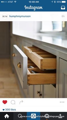 the drawers in this kitchen are open to reveal what's inside and how it looks like