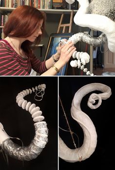 the woman is working on her art project with plastic tubes and wire wrapped around it