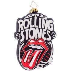 the rolling stones ornament hanging on a white wall with red and black lips