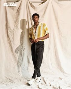 a man standing in front of a white backdrop