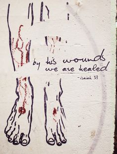 graffiti on the side of a white wall with words written in red and black ink