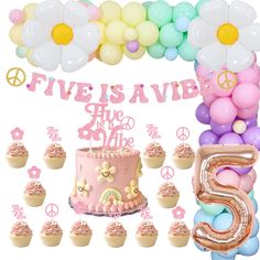 a pink cake surrounded by balloons and cupcakes with the number five on it