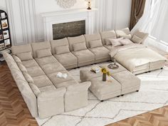 a living room with a large sectional couch and ottoman