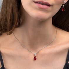 Features * Stylish Red necklace with a teardrop pendant on a stone-studded bail with an adjustable 18" chain, including 2-inch extension links. * 925 Sterling silver pendant necklace for women with a 8mm by 21 mm ruby red pendant. Stylish stone necklaces for women with 8mm by 12mm red pear-shaped stone with delicate    AAA cubic zirconia stones on the bail. * Solid silver chain and pendant. These elegant red necklaces for women are made from Rhodium plated 925 Sterling Silver. * High quality 925 Luxury Silver Ruby Necklace, Luxury Red Teardrop Pendant Jewelry, Ruby Necklaces Simple, Luxury Red Necklace With Prong Setting, Cheap Red Jewelry With Natural Stones, Cheap Red Jewelry For Everyday Wear, Luxury Red Minimalist Necklace, Cheap Red Formal Necklaces, Luxury Ruby Teardrop Pendant Jewelry