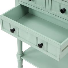 a green desk with two drawers and one drawer open