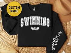 Funny custom swim mom to show your favorite swimmer support. Awesome gift for Mothers Day, Fathers day, or competition day. Funny personalized swimming life sweatshirts are the perfect gag gift. Fun way to show your daughter how much you care. Inexpensive gift idea perfect for putting a smile on her face. 🎈WELCOME TO Gifting Press If you are looking for soft, comfy, first-rate sweatshirts, you're in the right place! Here at Gifting Press, we love what we do and strive to make your shopping expe Mom Shirt Ideas, Swim Mom Shirt, Sweatshirts Cute, Name Sweater, Swim Life, Swim Mom, Gift For Mothers Day, Mom Hoodies, Inexpensive Gift