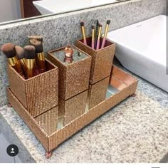 an image of a bathroom set up with makeup brushes and toiletries in the holder