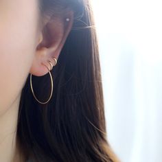 a close up of a person wearing earrings