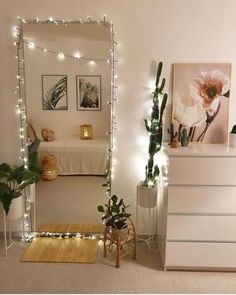 a bedroom decorated with lights and plants