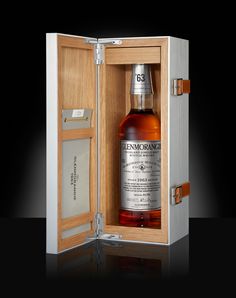 a bottle of whisky in a wooden case