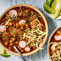 two bowls filled with meat, beans and radishes on top of a marble table