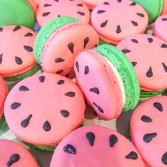 watermelon macaroons with black dots on them