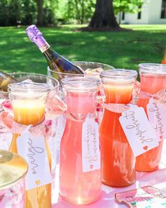 there are many glasses and bottles on the table