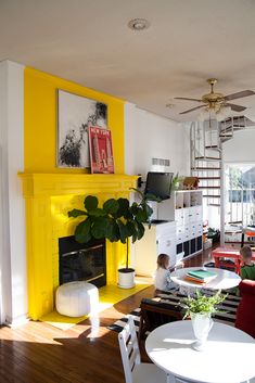 a living room filled with furniture and a fire place