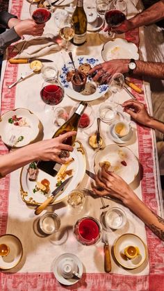 a group of people sitting at a dinner table