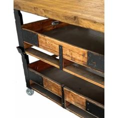 a wooden table with metal drawers and wheels