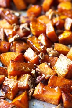 roasted sweet potatoes and pecans on a baking sheet