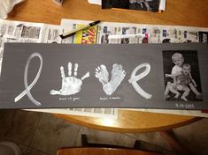 an image of someone's handprints on their website page with the word love written in white