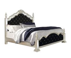 a white bed with black headboard and night stands on it's sides, in front of a white background