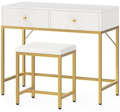 a white and gold desk with two stools