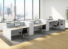 an office cubicle with three desks and two chairs in front of large windows