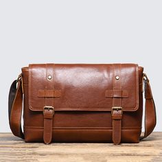 Leather Messenger Bag Full Grain Leather Shoulder Bag We use selected full grain cowhide leather, quality hardware to make the bag as good as it is. This bag is perfect as your everyday bag, which can fit a 12'' laptop, iPad, cell phone, wallet as well as many accessories. Features: 1. 100% Full Grain Leather2. Solid Quality Hardware3. Adjustable Shoulder Strap4. Inside 1 Zipper Pocket, 2 Open Pockets, Outside 1 Back Zipper Pocket5. It Can Fit a 12'' laptop, iPad, Cell Phone, Wallet, etc. Dimensions: 13.7" L x 9"H x 3.1"W / 35cm x 23cm x 8cm Color: Dark Coffee/Vintage Brown Leather Satchel Laptop Bag With Smooth Grain, Brown Leather Shoulder Bag For Office, Smooth Grain Leather Laptop Satchel, Brown Leather Crossbody Briefcase, Brown Leather Backpack For Business, Brown Soft Leather Crossbody Laptop Bag, Leather Crossbody Laptop Bag For Office, Brown Crossbody Laptop Bag For Business, Brown Crossbody Laptop Bag For Office