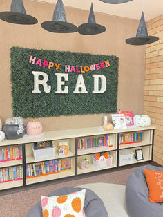 a halloween themed room with bookshelves and decorations