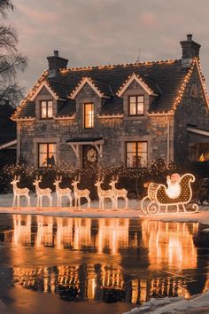 a house decorated with christmas lights and reindeers