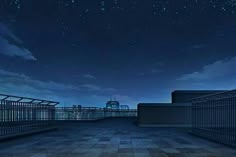 an empty rooftop at night with stars in the sky