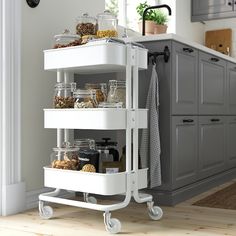 a kitchen cart filled with lots of food